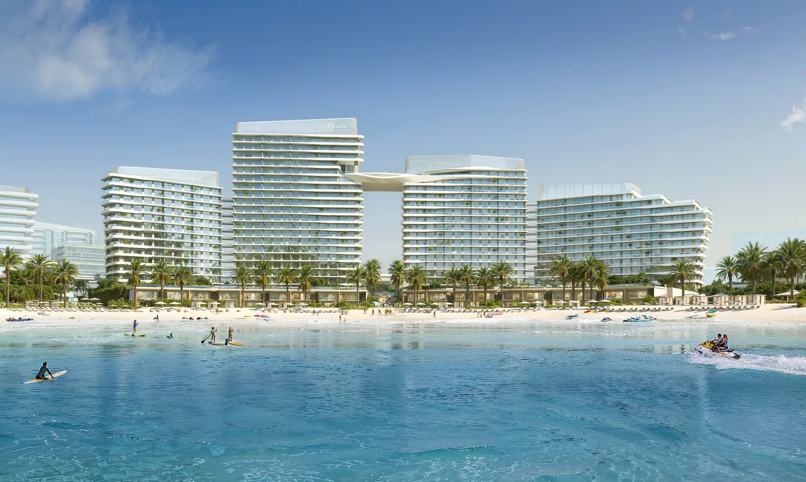 Fairmont Residences Al Marjan Island beachfront exterior at golden hour